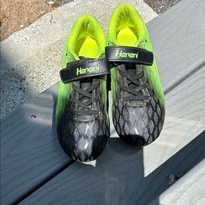 Soccer Cleats. Harari junior Green and Black with Velcro and faux laces.